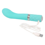 Turkis silikon G-punkt vibrator med bøyd tupp, riller og Swarovski krystaller, med hvit USB-ladekabel.