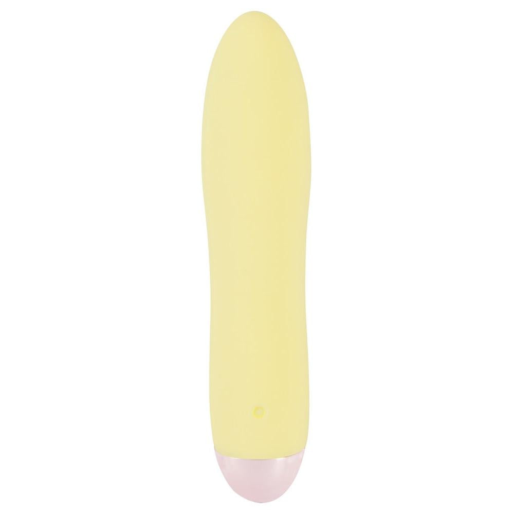 Gul Mini Cutie klitorisvibrator i silkemyk silikon med rosa base og diskret kontrollknapp.