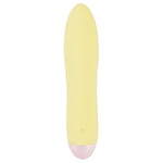 Gul Mini Cutie klitorisvibrator i silkemyk silikon med rosa base og diskret kontrollknapp.