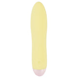 Gul Mini Cutie klitorisvibrator i silkemyk silikon med rosa base og diskret kontrollknapp.