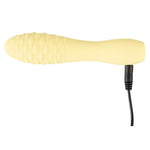 Gul silikon klitorisvibrator med strukturert overflate og svart ladekabel.