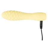 Gul silikon klitorisvibrator med strukturert overflate og svart ladekabel.