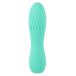 Turkis silikon minivibrator med rillet tekstur for klitorisstimulering.