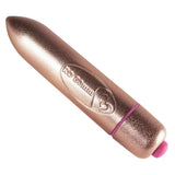 RO-80 Bullet Klitorisvibrator i rosegull med spiss tupp og lilla detaljer.