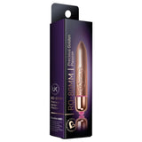 Gullfarget RO-80 Bullet Klitorisvibrator i metallisk finish, med spiss tupp og lilla emballasje.