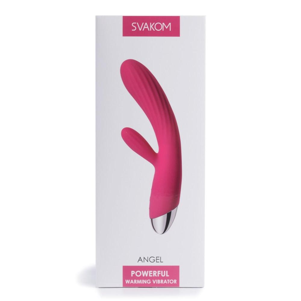 Rosa silikon rabbitvibrator med riller og metalltupp, vist på hvit emballasje.