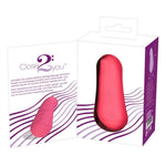 Corallino klitorisvibrator i matt rosa silikon, vist i og utenfor hvit emballasje.