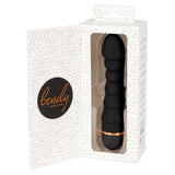 Svart silikon Bendy Ripple vibrator med penisformet tupp og 5 pirrebølger, delvis synlig i hvit eske.