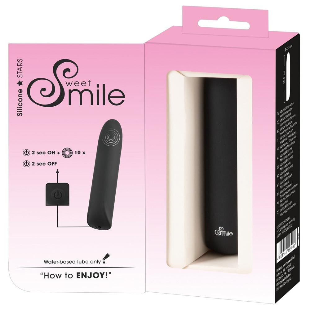 Sweet Smile svart silikon klitorisvibrator i rosa og hvit emballasje med produktinformasjon.