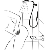 Svart-hvitt illustrasjon av en person som dusjer, med en Piccolo dildo festet til flisveggen.