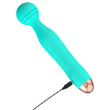 Turkis Cuties AquaVibe klitorisstimulator med rillet hode, gullfarget base og ladekabel.