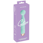 Turkis Cuties AquaVibe klitorisstimulator i silkemyk silikon med rillet design, vist i lilla emballasje.