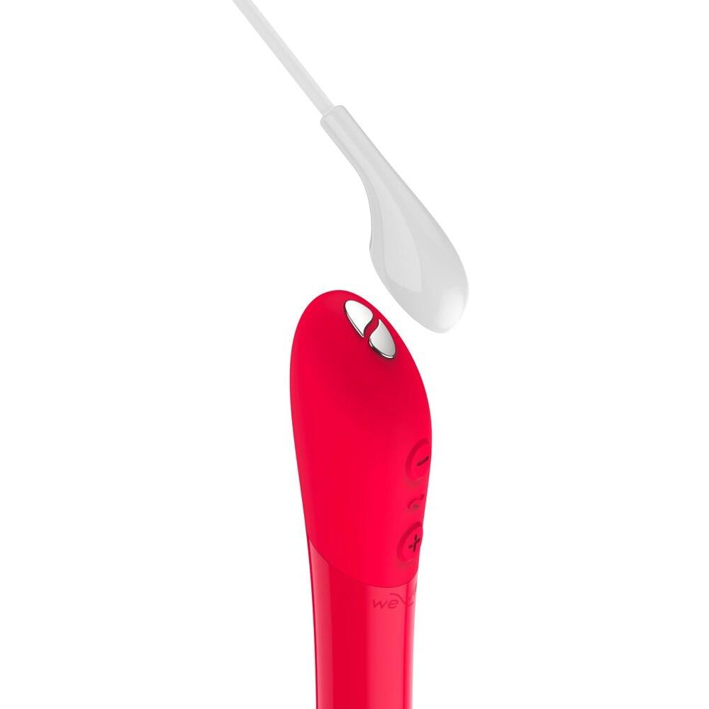 Rød We-Vibe Tango X klitorisstimulator i silikon med spiss tupp og kontrollknapper.