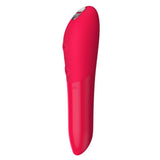 Rød We-Vibe Tango X klitorisstimulator med spiss tupp og kontrollknapper.