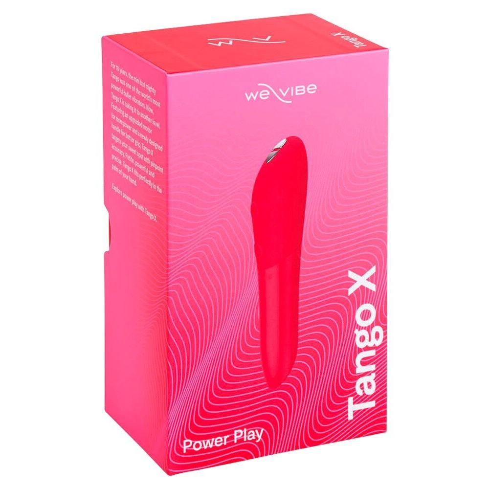 Rød We-Vibe Tango X klitorisstimulator i en rosa og hvit eske med produktinformasjon.