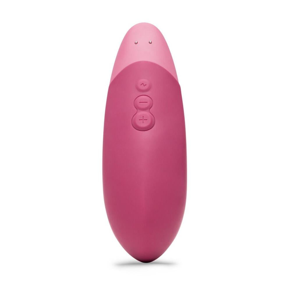Mørk rosa Womanizer VIBE klitorisstimulator i silikon med ergonomisk design og kontrollknapper.