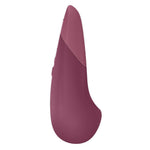 Womanizer VIBE klitorisstimulator i mørk rosa silikon med ergonomisk design og kontrollknapper.