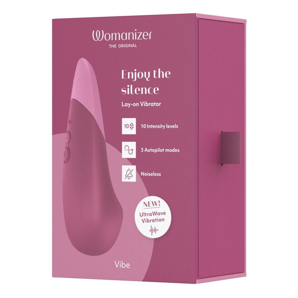 Womanizer VIBE klitorisstimulator i mørk rosa eske med produktfunksjoner og UltraWave Vibration-logo.