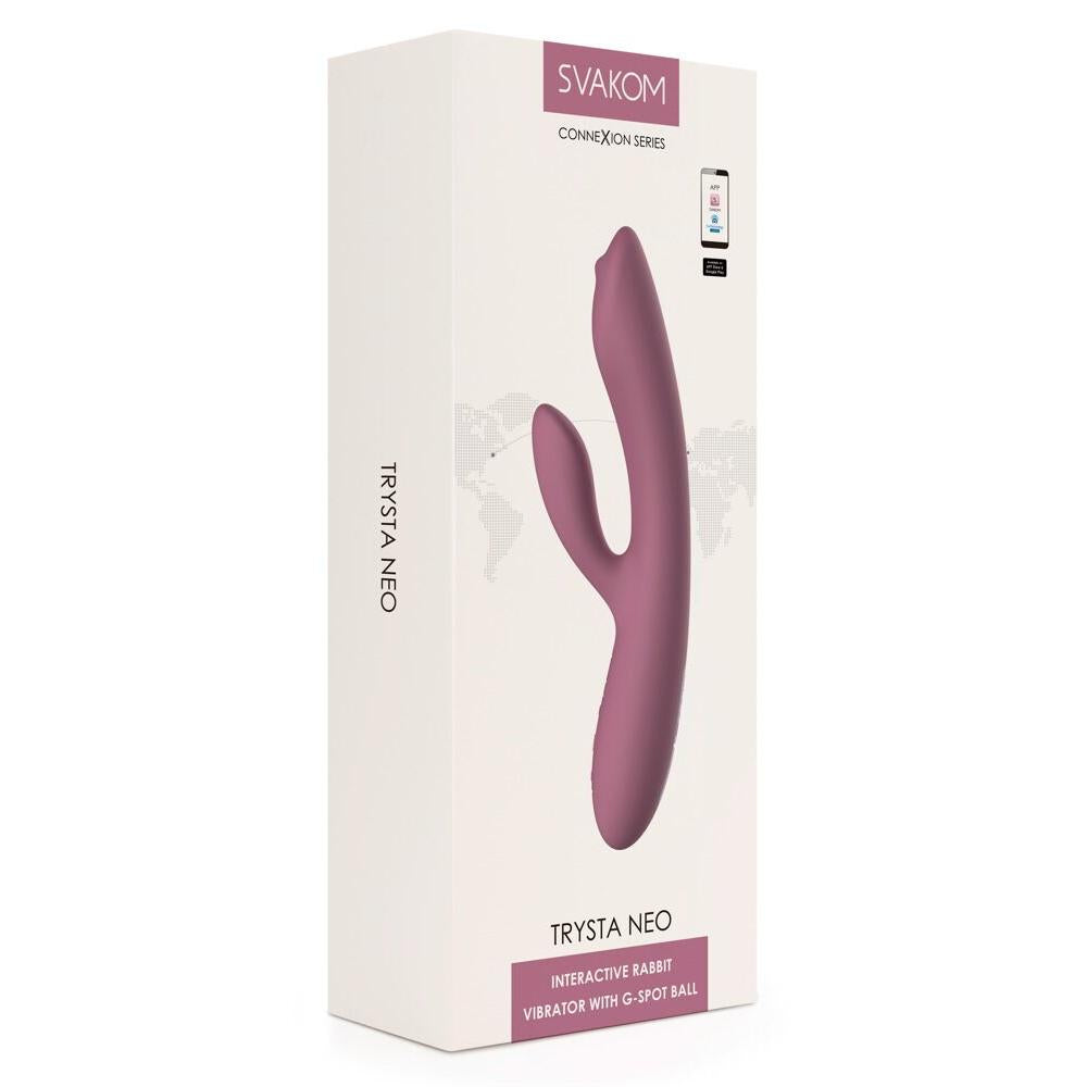 Trysta Neo interaktiv rabbitvibrator i lilla silikon med G-punkt massasjekule, vist i hvit emballasje.