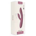 Trysta Neo interaktiv rabbitvibrator i lilla silikon med G-punkt massasjekule, vist i hvit emballasje.