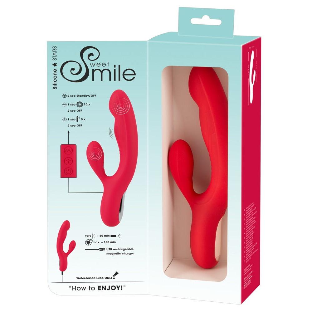 Rød silikon rabbitvibrator med dunkende funksjon og USB-lader, vist i åpen produktemballasje.