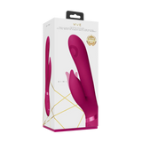 Aimi Rosa Rabbitvibrator i hvit eske med gullaksenter, viser produktet i mørk rosa silikon.