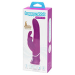 Lilla HappyRabbit Power Motion rabbitvibrator i silikon med buet skaft og klitorisstimulator, vist foran esken.