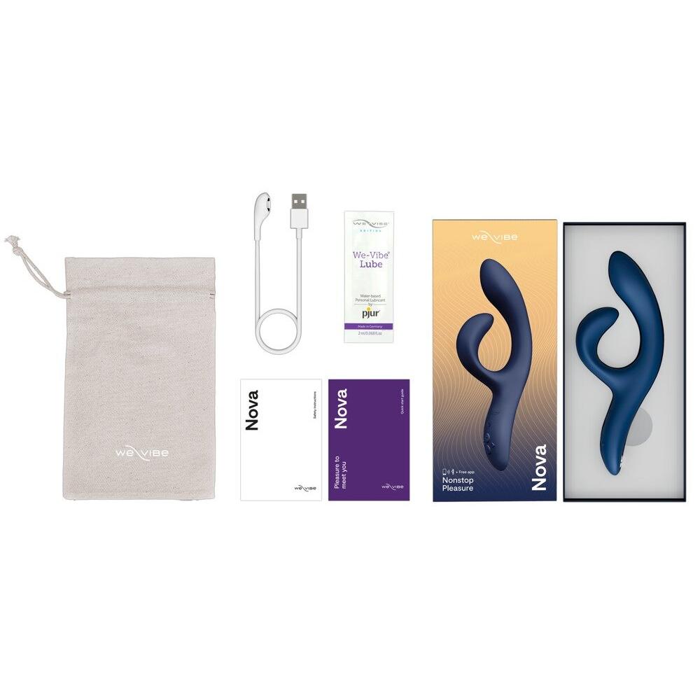 We-Vibe Nova 2 rabbitvibrator i dyp blå, med ladekabler, oppbevaringspose, smøremiddel og emballasje.