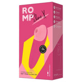 ROMP Shine X lufttrykksvibrator i rosa emballasje med produktbilde og funksjonsdetaljer.