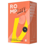 ROMP Switch X sugevibrator i ferskenfarget silikon, vist i emballasje med produktfunksjoner.