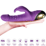 Lilla Armony Zing Rabbit vibrator i medisinsk silikon, med ribbet skaft og gullfarget tupp, holdt i en hånd.