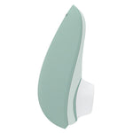 Womanizer Liberty 2 i myk mintgrønn, elegant og kompakt sugevibrator med hvite detaljer.