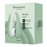 Womanizer Liberty 2 i myk mintgrønn, kompakt sugevibrator med magnetisk deksel og 8 intensitetsnivåer.