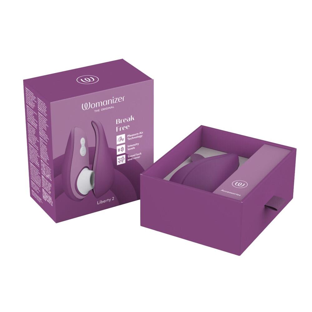 Womanizer Liberty 2 i lilla med magnetdeksel, vist i åpen og lukket eske.