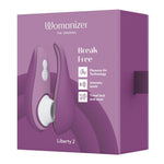 Womanizer Liberty 2 i lilla, med magnetdeksel og Pleasure Air Technology, vist i esken.