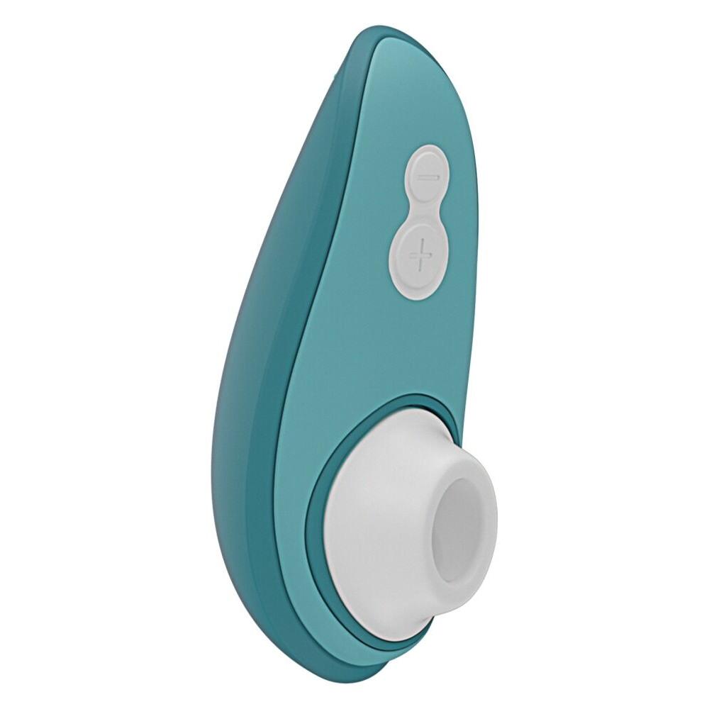 Mørkegrønn Womanizer Liberty 2 sugevibrator med hvit silikonmunnstykke og kontrollknapper.