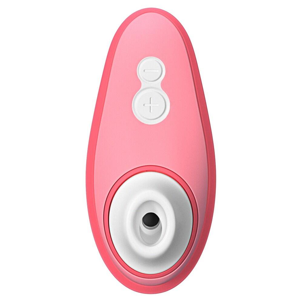 Womanizer Liberty 2 i korallrosa med hvite kontrollknapper og stimuleringshode.