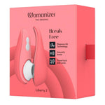 Womanizer Liberty 2 i korallrosa, med magnetdeksel og Pleasure Air Technology.