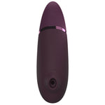 Womanizer NEXT sugevibrator i elegant lilla med Soft Touch-overflate og metallisk ring.