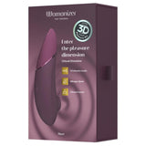 Womanizer NEXT lilla sugevibrator med Soft Touch-overflate og 3D Pleasure Air-teknologi i esken.