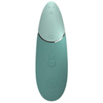 Womanizer NEXT sugevibrator i mintgrønn med Soft Touch-overflate og kontrollknapper.