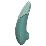 Womanizer NEXT sugevibrator i mintgrønn med elegant, kurvet Soft Touch-design og sølvdetaljer.