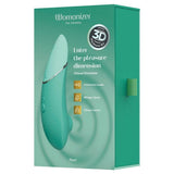 Womanizer NEXT mintgrønn sugevibrator i elegant design med Soft Touch-overflate, vist i esken.