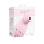 Lys rosa Kissable sugevibrator i medisinsk silikon, vist i sin hvite og rosa emballasje.