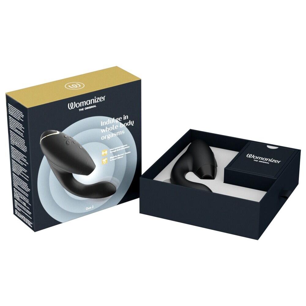 Womanizer Duo 2 svart klitoris- og G-punktstimulator i åpen eske med gull og svart design.