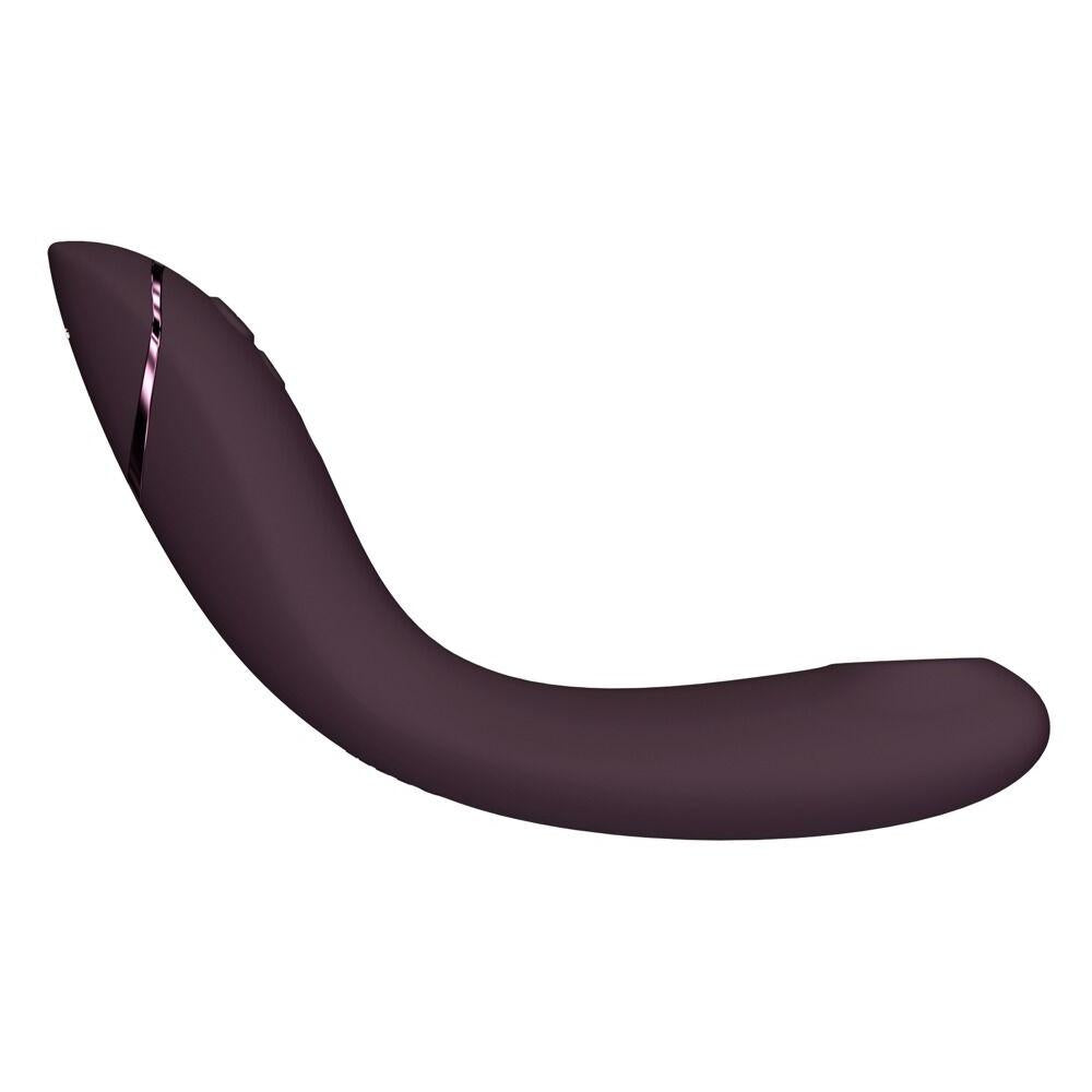 Womanizer OG G-punktvibrator i burgunderrød silikon med fleksibel stav og metalliske detaljer.