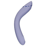 Womanizer OG G-punktvibrator i elegant lilla silikon med buet design og metallisk detalj.