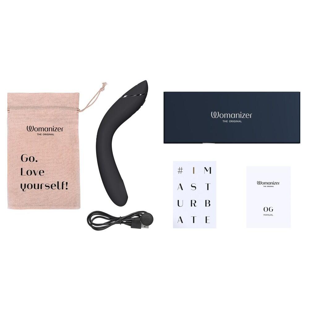 Womanizer OG sort G-punktvibrator med Pleasure Air-teknologi, ladekabel, manual og oppbevaringspose.