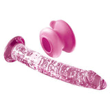 Gjennomsiktig rosa glassdildo med teksturert overflate og en avtakbar rosa sugekopp.