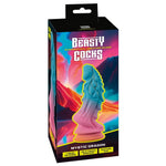 Mystic Dragon fantasydildo i rosa og blå glitrende Liquid Silicone med sugekopp, i emballasje.